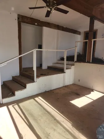 a view of a hallway with staircase