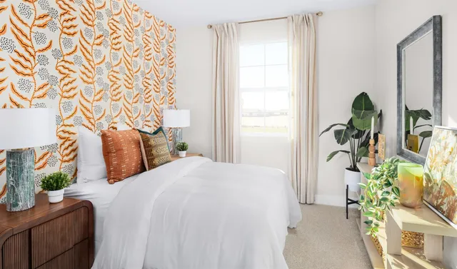 a bedroom with bed and window