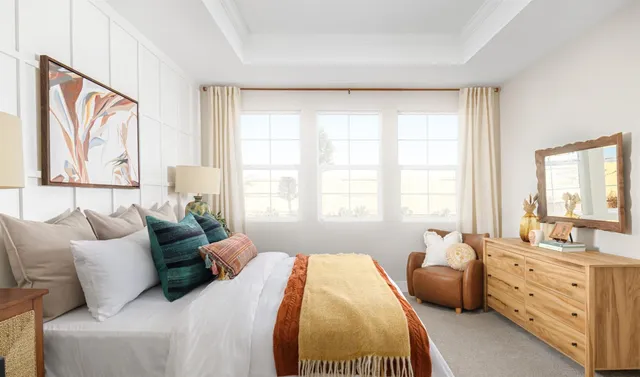 a bathroom with a sink mirror and shower