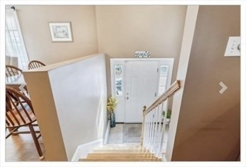 65 Camden Street, Unit 1 Lynn, MA 01905 - Photo 13 of 14 a view of a livingroom with furniture and stairs