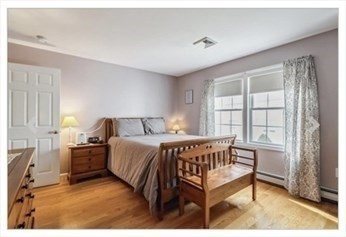 65 Camden Street, Unit 1 Lynn, MA 01905 - Photo 9 of 14 a bedroom with a bed and window