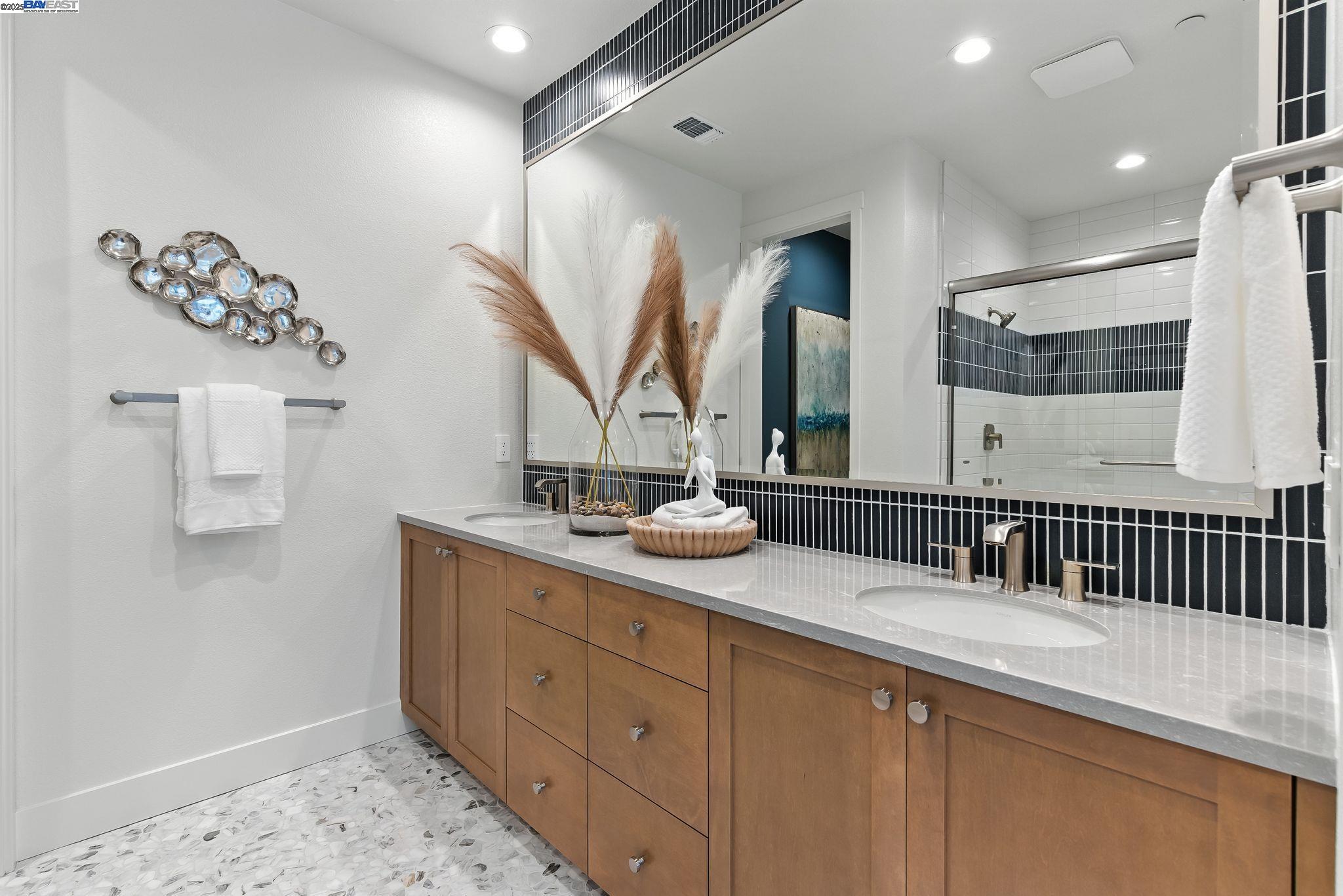 1937 Grand Street Alameda, CA 94501 - Photo 24 of 29 a bathroom with a double vanity sink and a mirror
