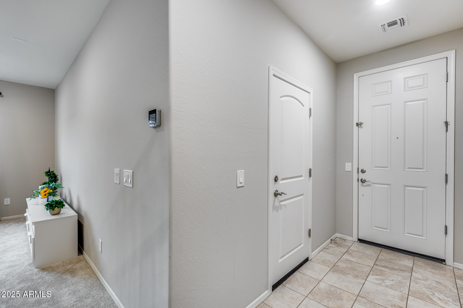 6853 East Posada Circle Mesa, AZ 85212 - Photo 11 of 45 a view of an entryway with wooden floor