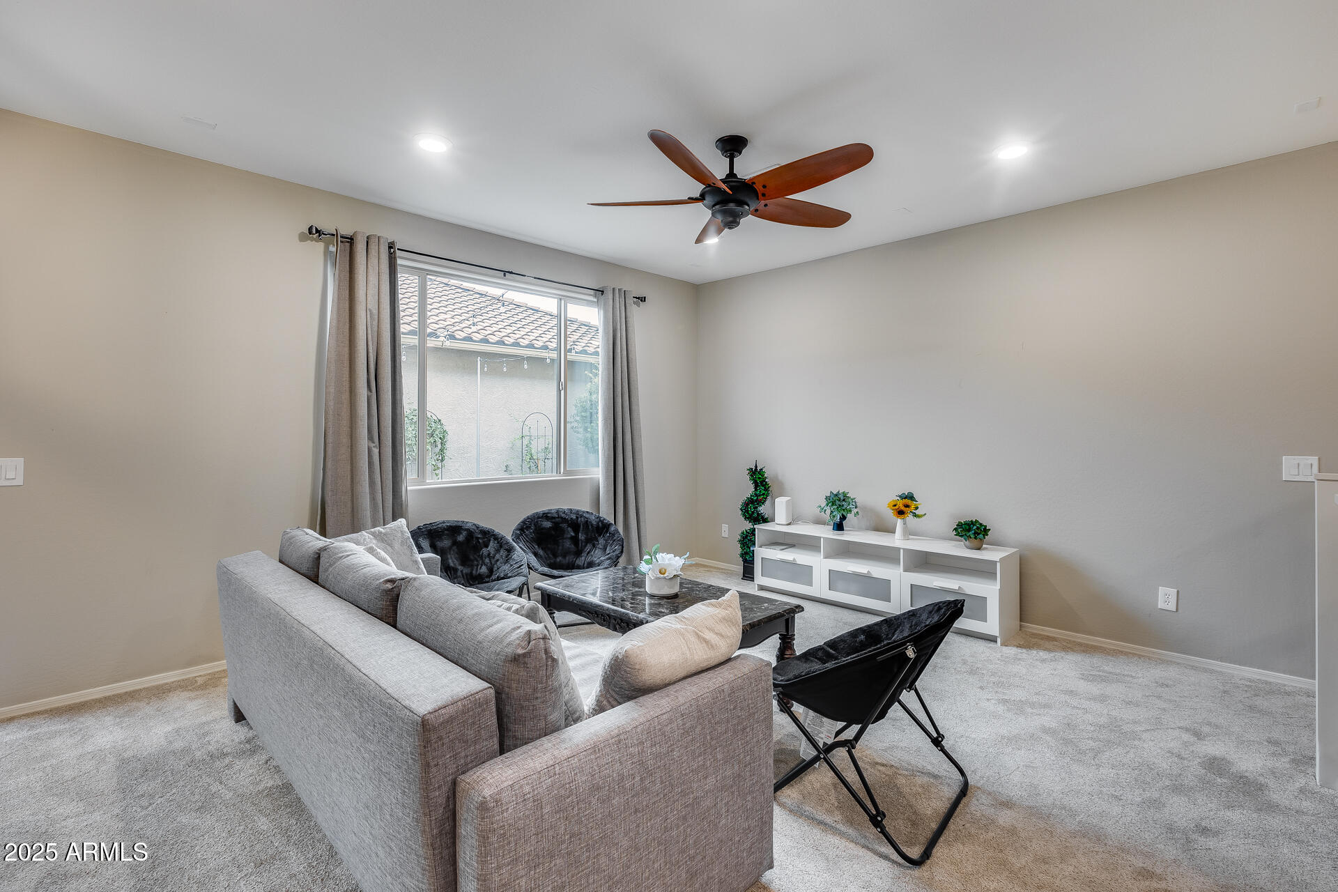 6853 East Posada Circle Mesa, AZ 85212 - Photo 12 of 45 a living room with furniture and a window