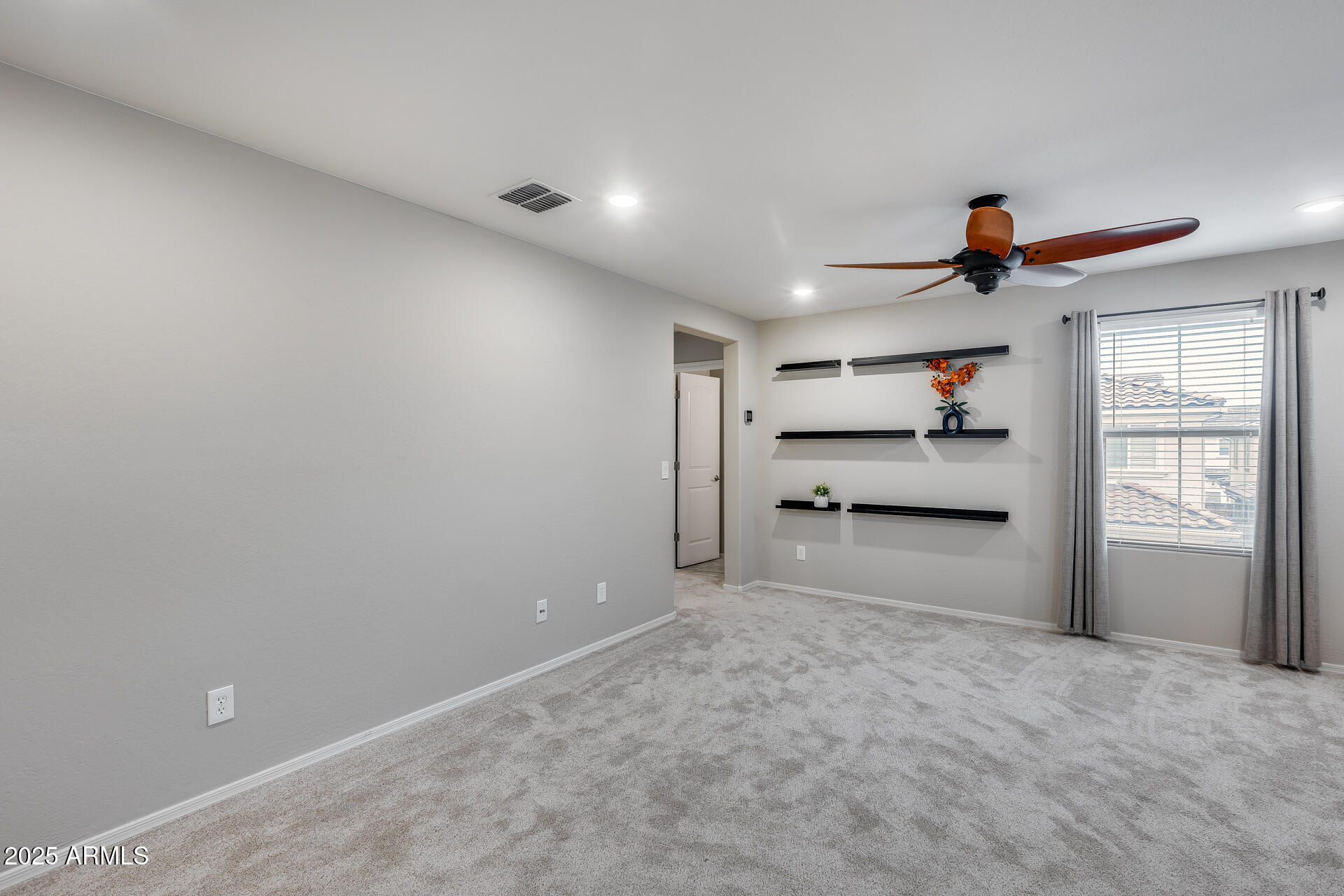 6853 East Posada Circle Mesa, AZ 85212 - Photo 21 of 45 a view of a livingroom with a fireplace