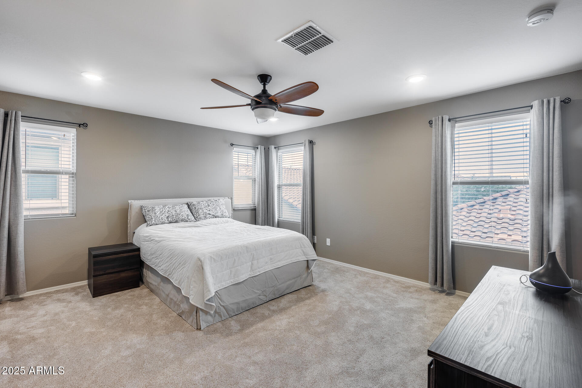6853 East Posada Circle Mesa, AZ 85212 - Photo 23 of 45 a bedroom with a large bed and a window