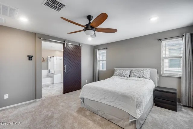 a bedroom with a large bed and a window