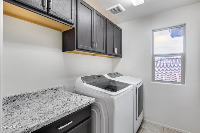 a bathroom with a sink vanity and mirror