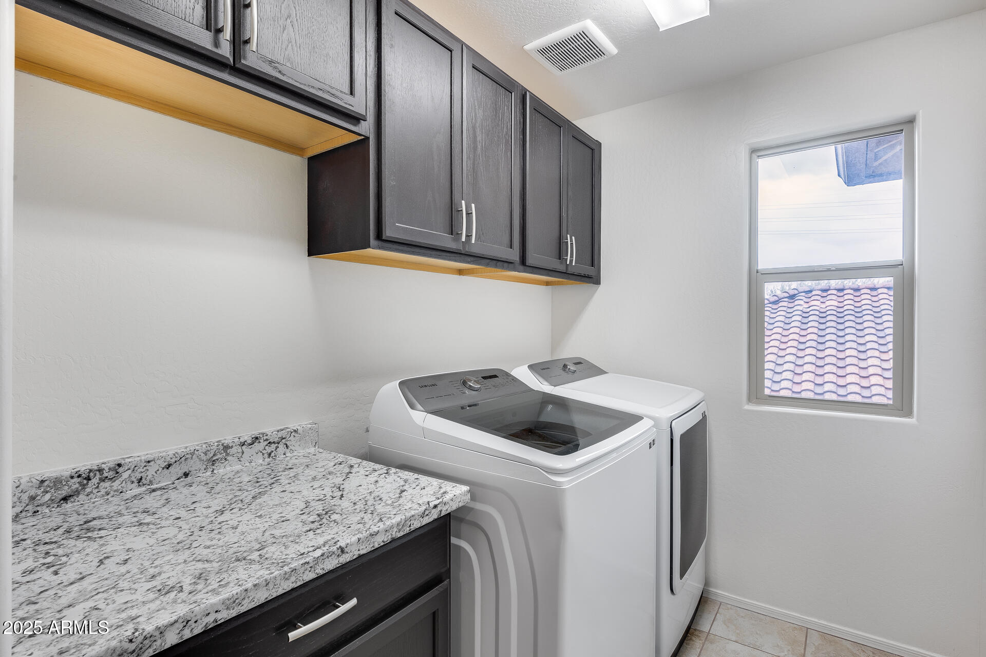 6853 East Posada Circle Mesa, AZ 85212 - Photo 28 of 45 a utility room with dryer and washer