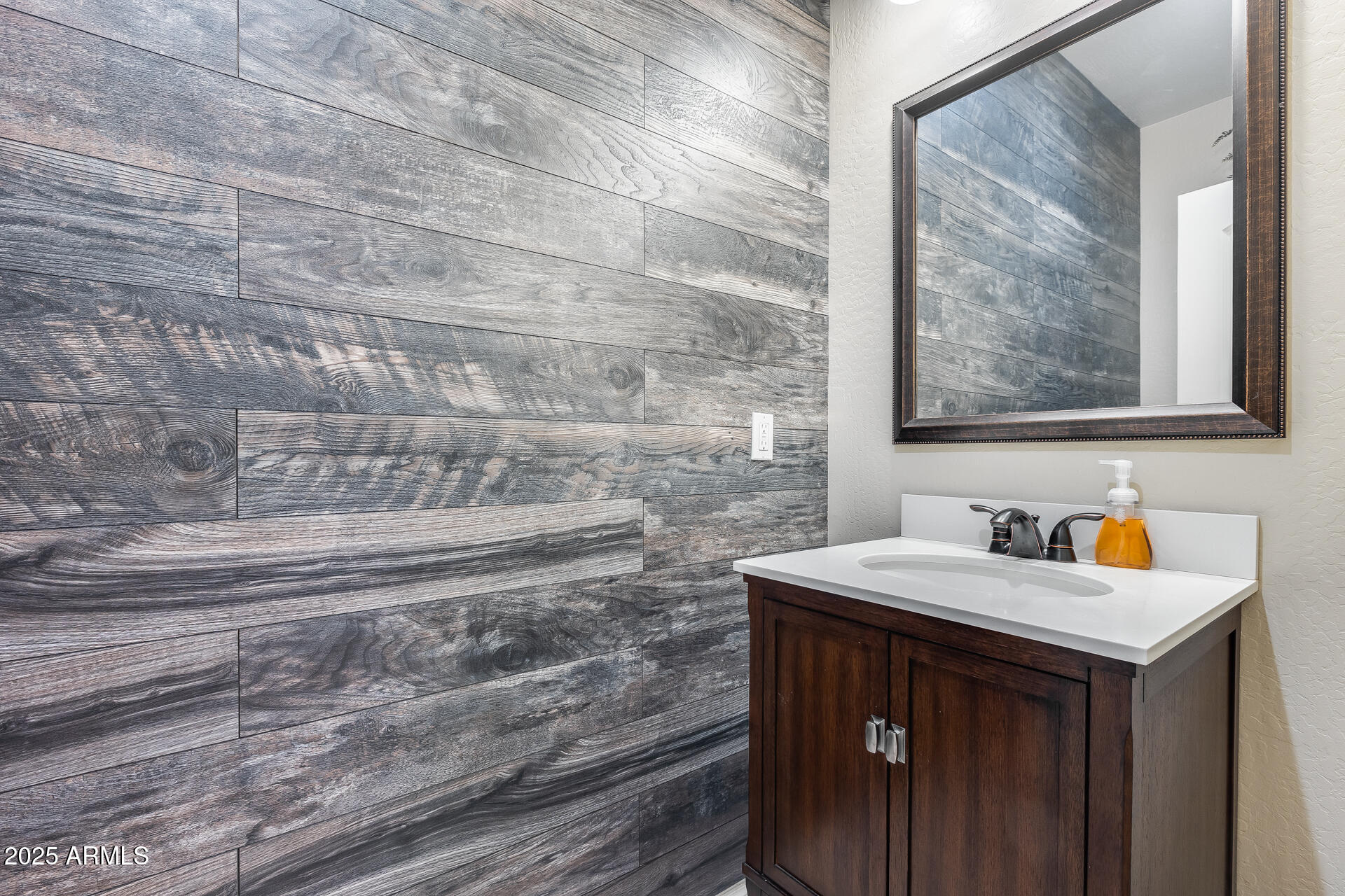 6853 East Posada Circle Mesa, AZ 85212 - Photo 37 of 45 a bathroom with a sink and a mirror