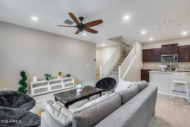 a living room with furniture and a window