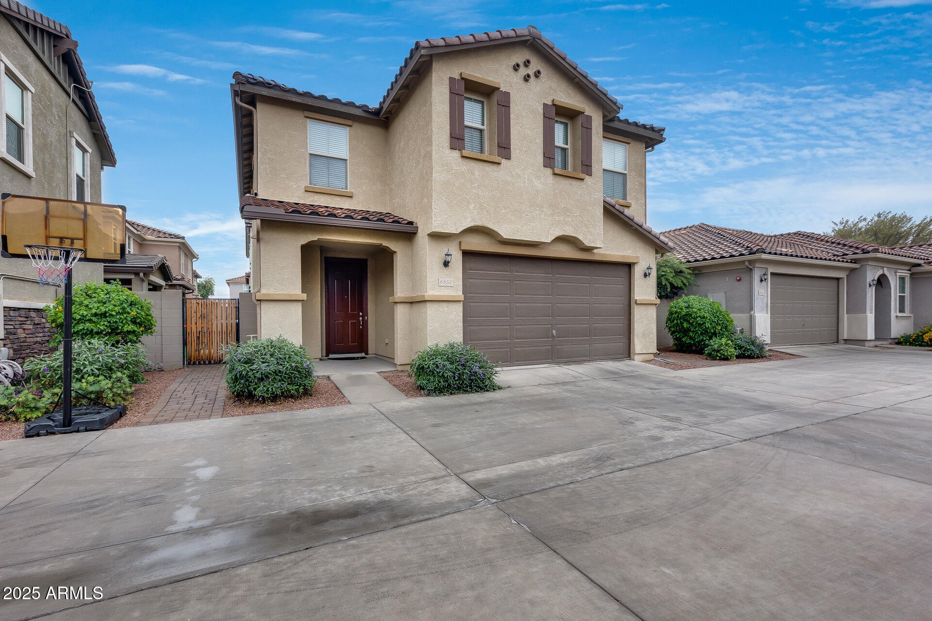 6853 East Posada Circle Mesa, AZ 85212 - Photo 6 of 45 a front view of a house with garden