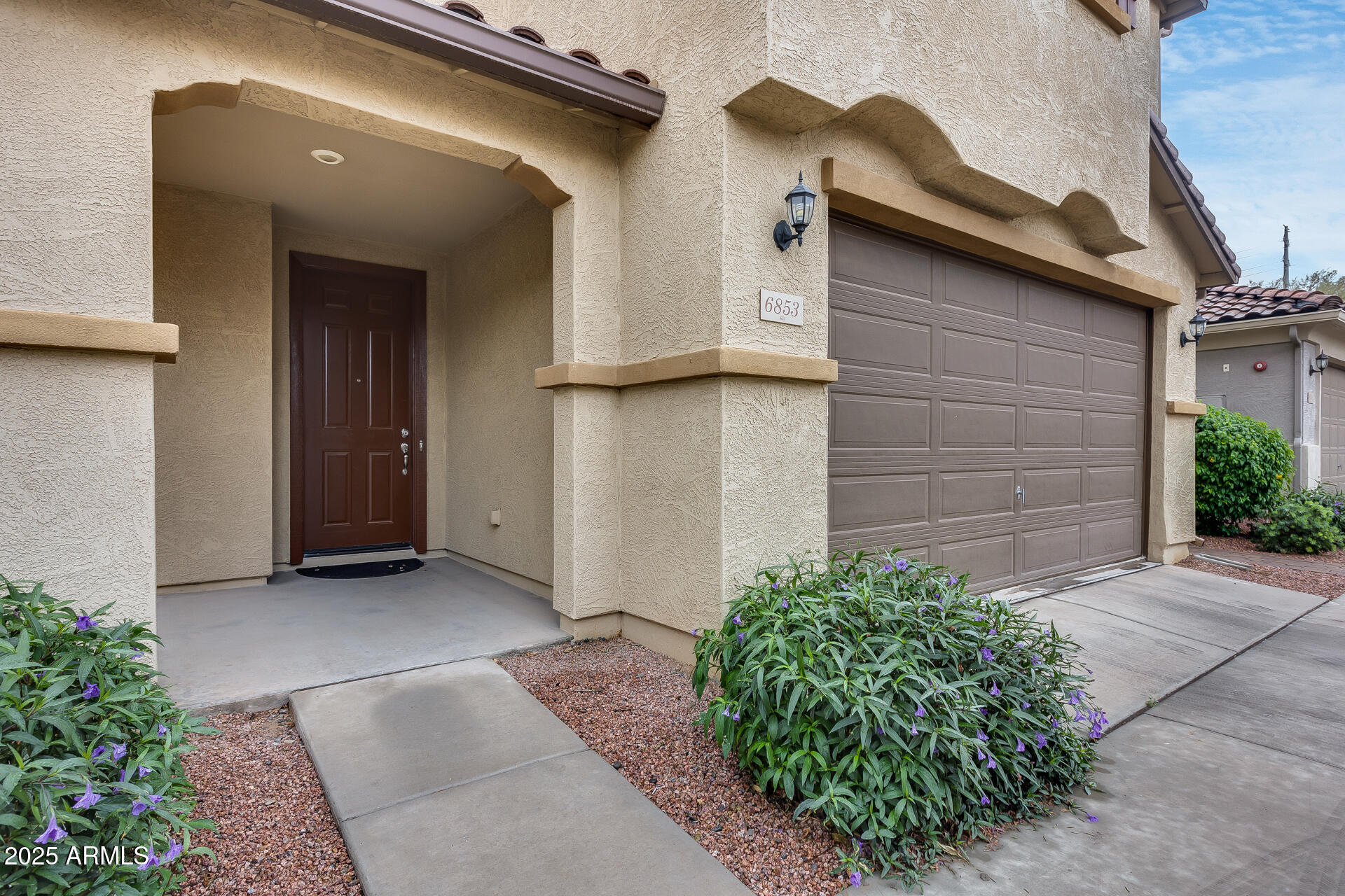 6853 East Posada Circle Mesa, AZ 85212 - Photo 8 of 45 a view of a house with a backyard
