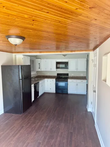 a view of a field with an ocean