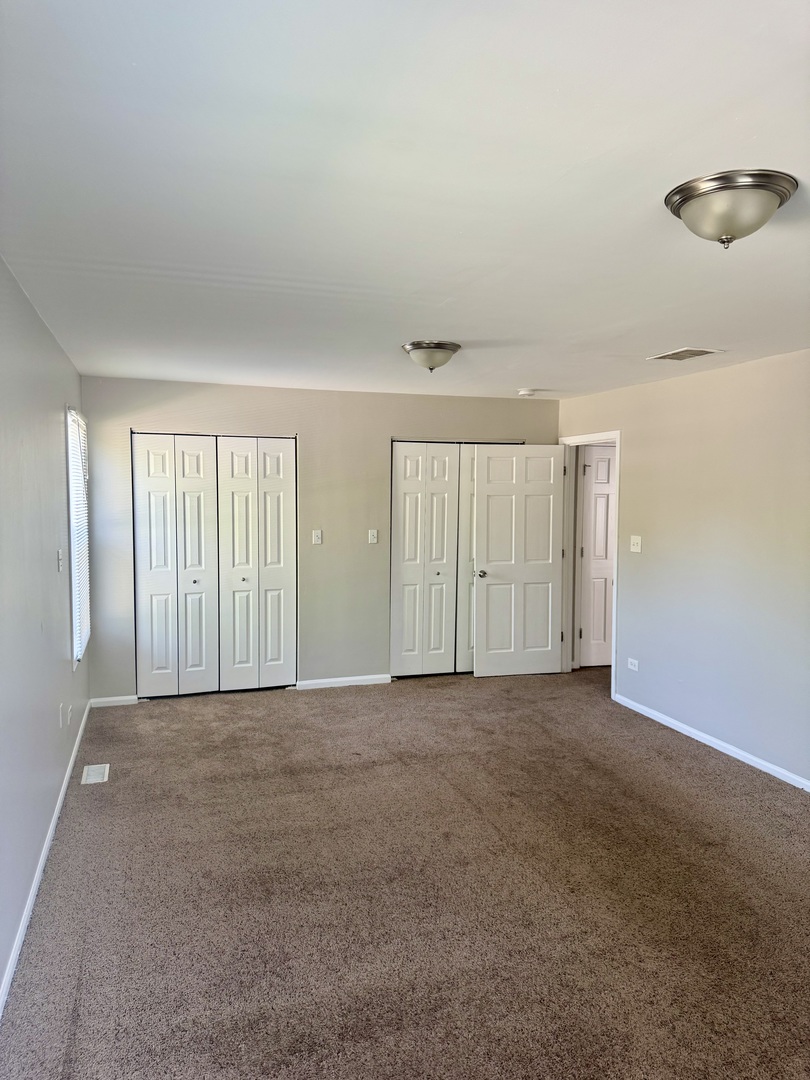 14503 Waverly Avenue Midlothian, IL 60445 - Photo 23 of 37 an empty room with windows