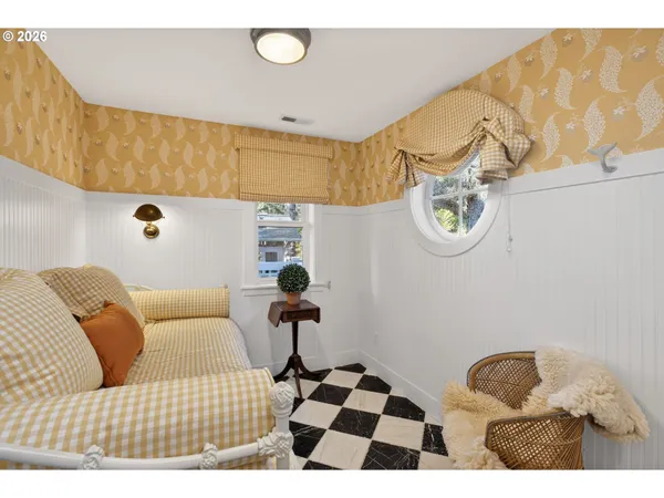 a bedroom with a bed and a couch