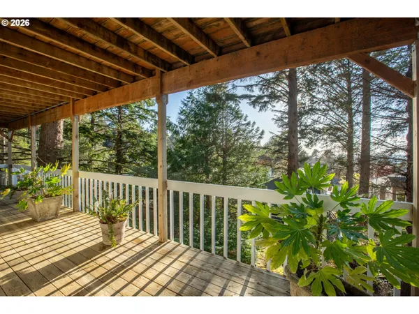 a view of balcony with wooden floor