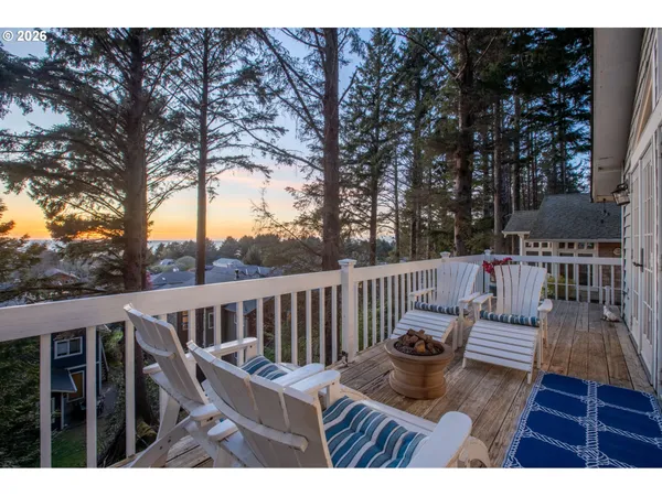 a view of balcony with wooden floor and outdoor seating