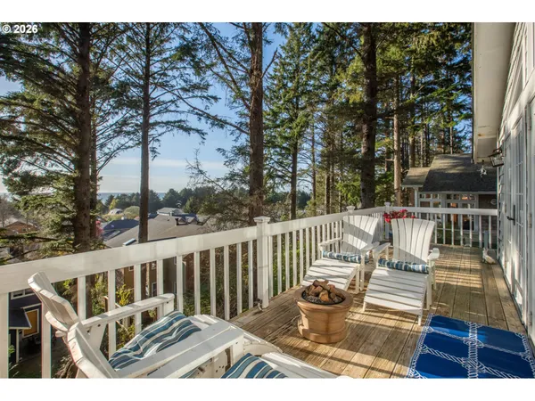 a view of a balcony with wooden floor