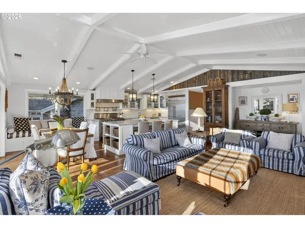 a living room with lots of furniture and a rug