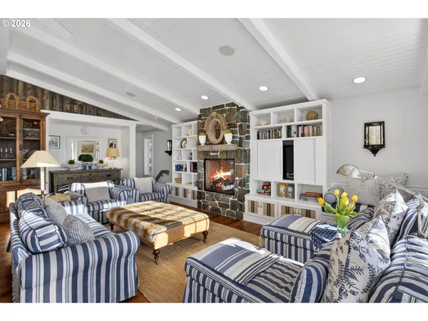 a living room with lots of furniture and kitchen view