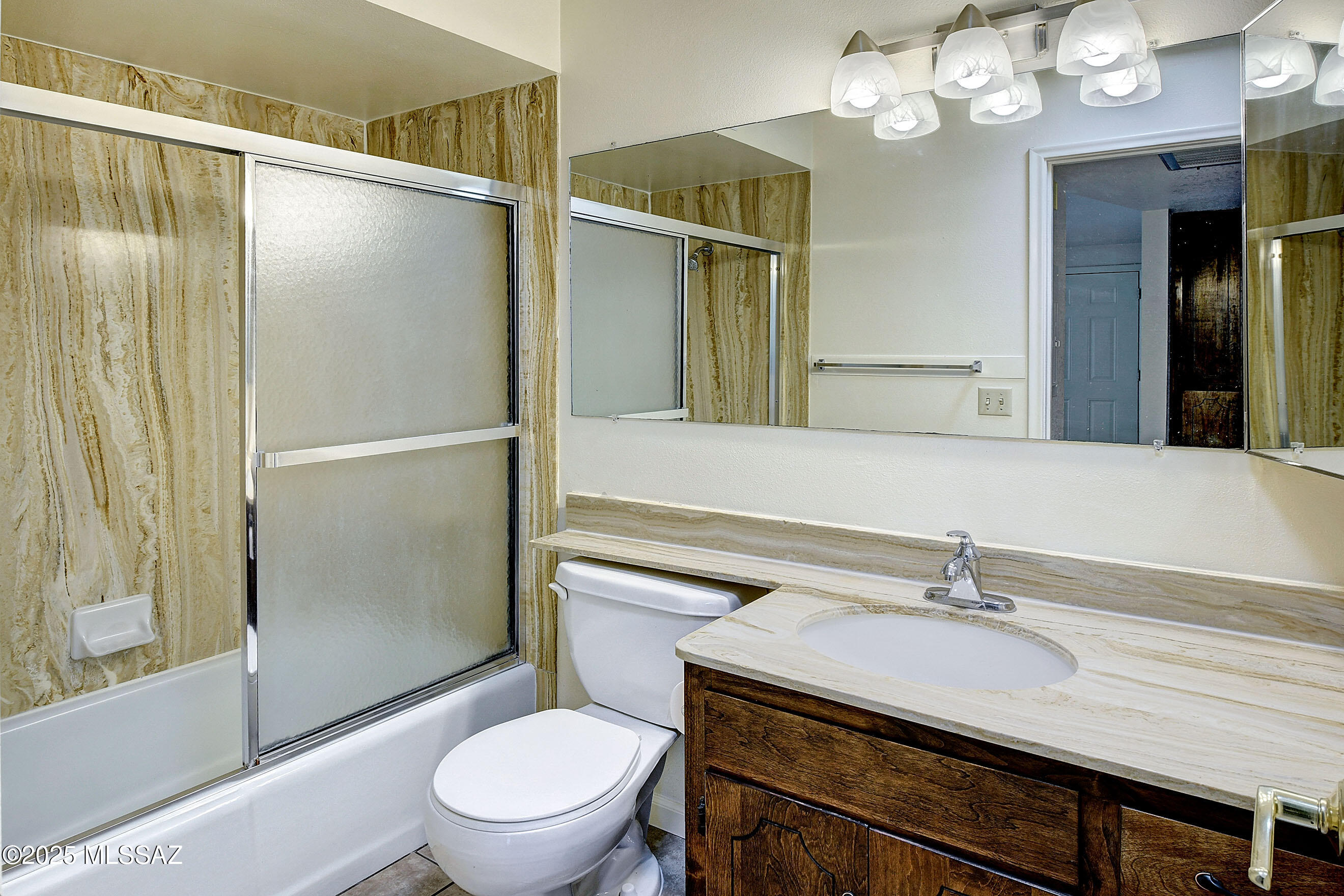 35 East Pastime Road Tucson, AZ 85705 - Photo 14 of 28 a bathroom with a sink toilet and shower