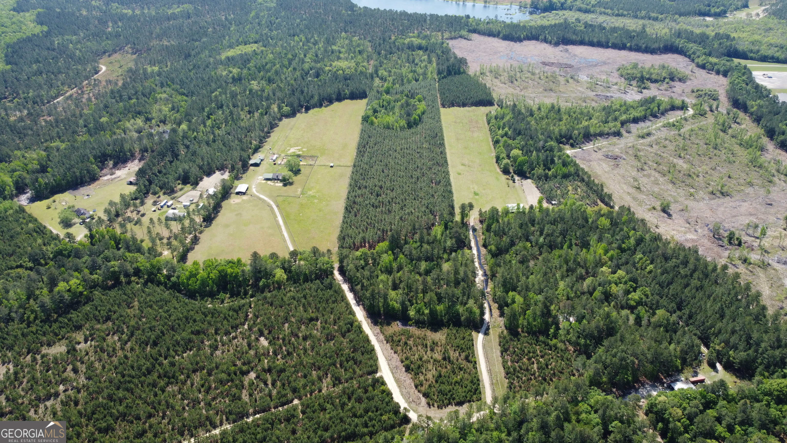 0 Old Happy Lane, Unit TRACT 2) Brooklet, GA 30415 - Photo 1 of 1 an aerial view of a house with a yard and large trees