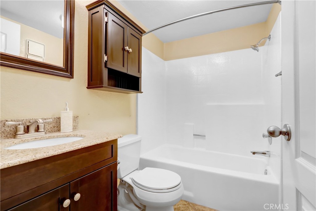 7622 Belpine Place Rancho Cucamonga, CA 91730 - Photo 13 of 15 a bathroom with a sink a toilet and a bathtub