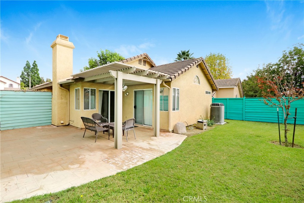 7622 Belpine Place Rancho Cucamonga, CA 91730 - Photo 14 of 15 a front view of a house with patio