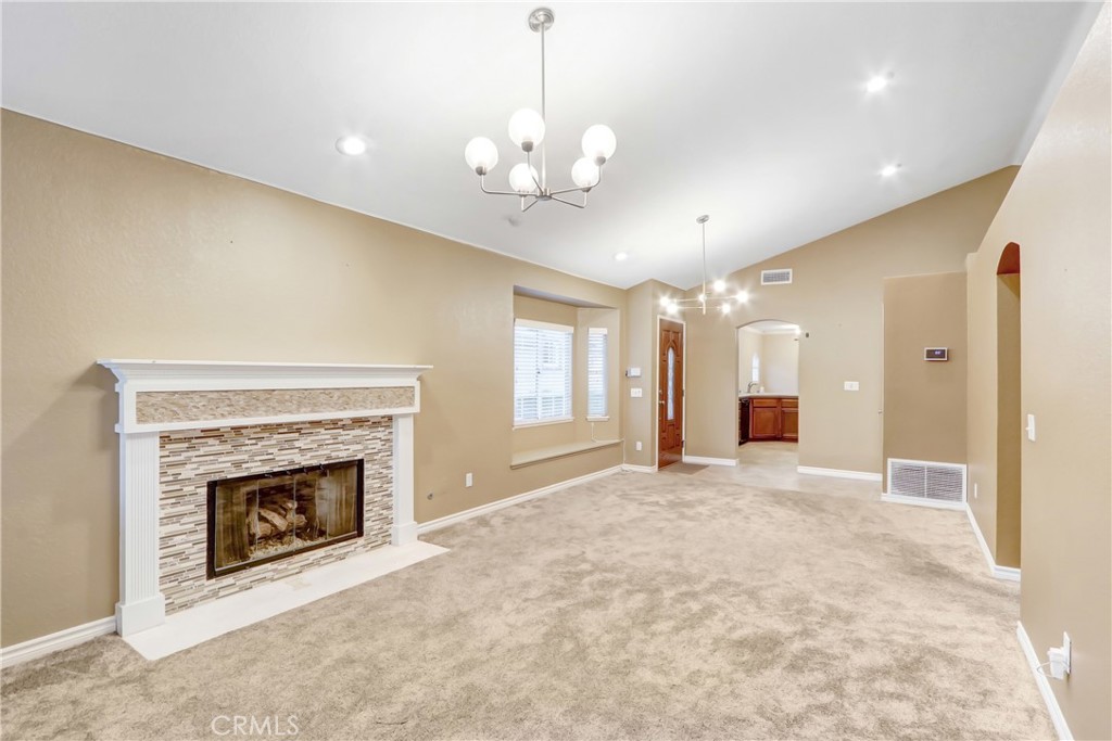 7622 Belpine Place Rancho Cucamonga, CA 91730 - Photo 3 of 15 a view of an empty room with window and fireplace