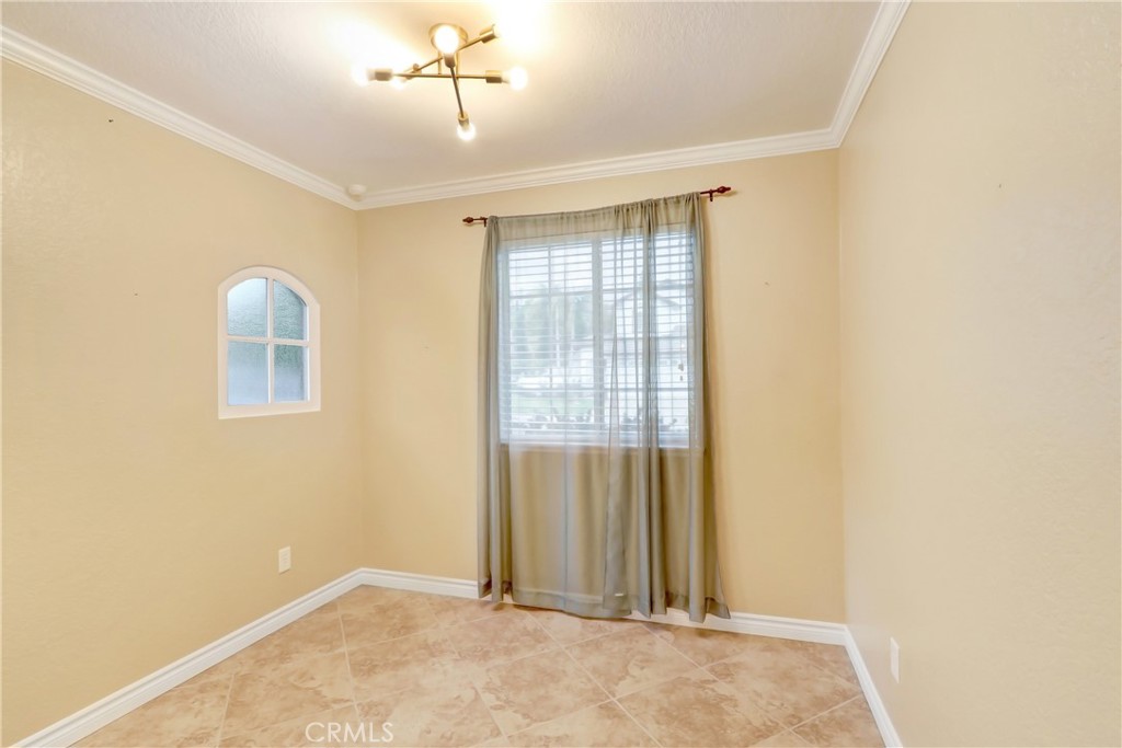 7622 Belpine Place Rancho Cucamonga, CA 91730 - Photo 8 of 15 a view of an empty room with a window