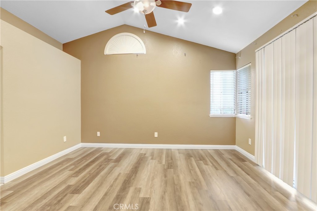 7622 Belpine Place Rancho Cucamonga, CA 91730 - Photo 9 of 15 a view of a room with a wooden floor and entryway