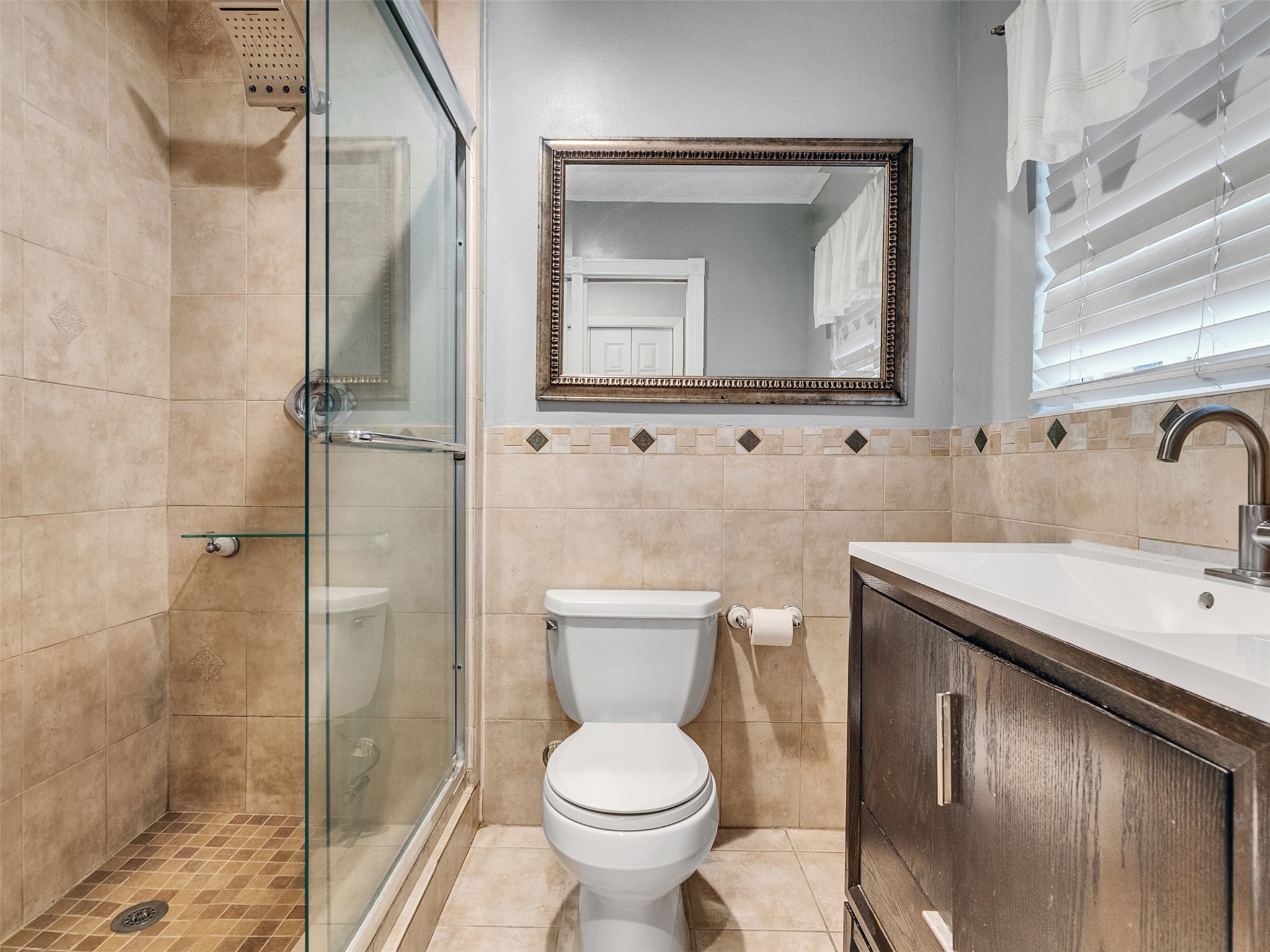 1630 Hollow Hook Road Houston, TX 77080 - Photo 20 of 22 a bathroom with a toilet sink and mirror