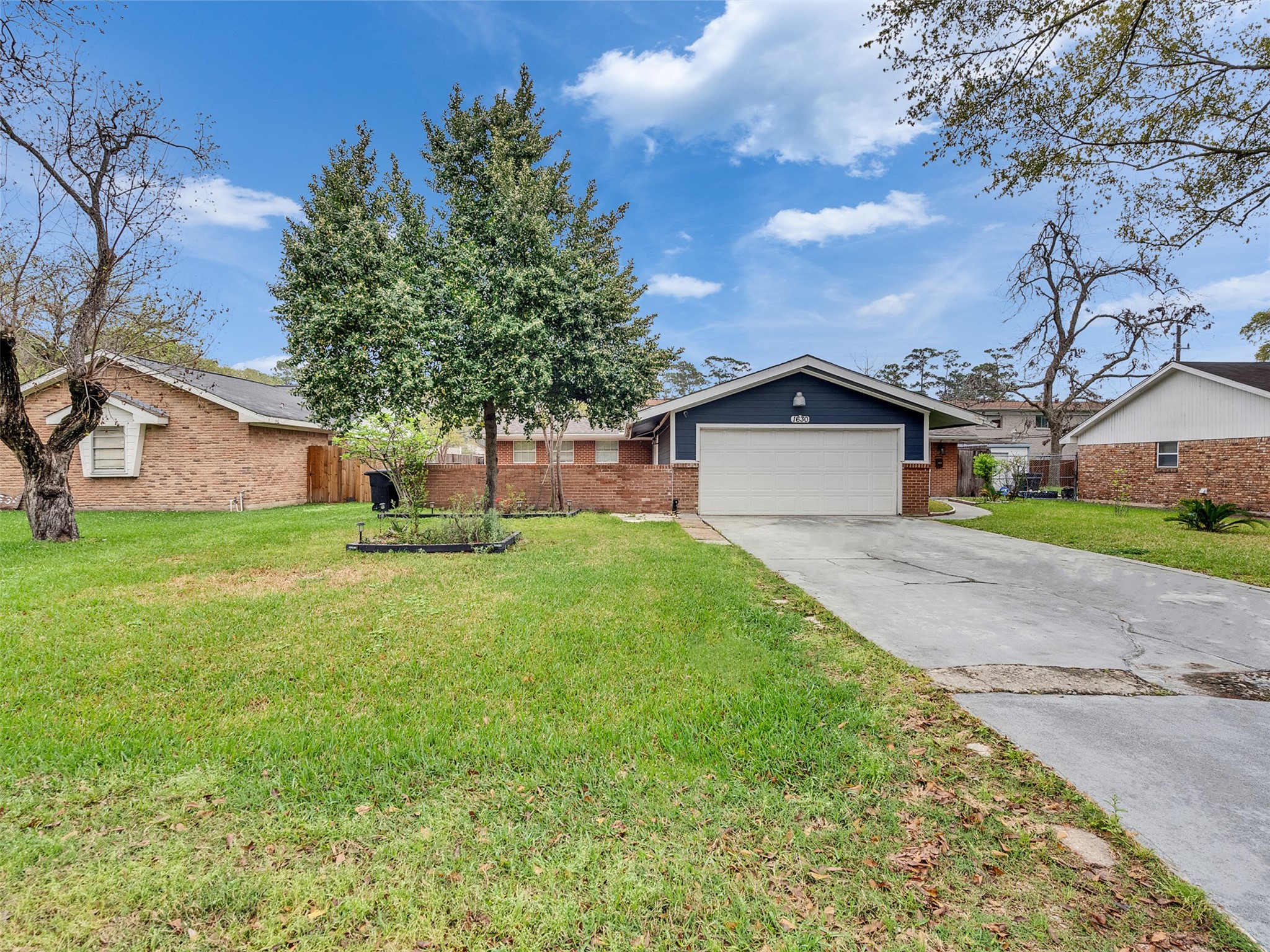 1630 Hollow Hook Road Houston, TX 77080 - Photo 2 of 22 a front view of house with yard and green space