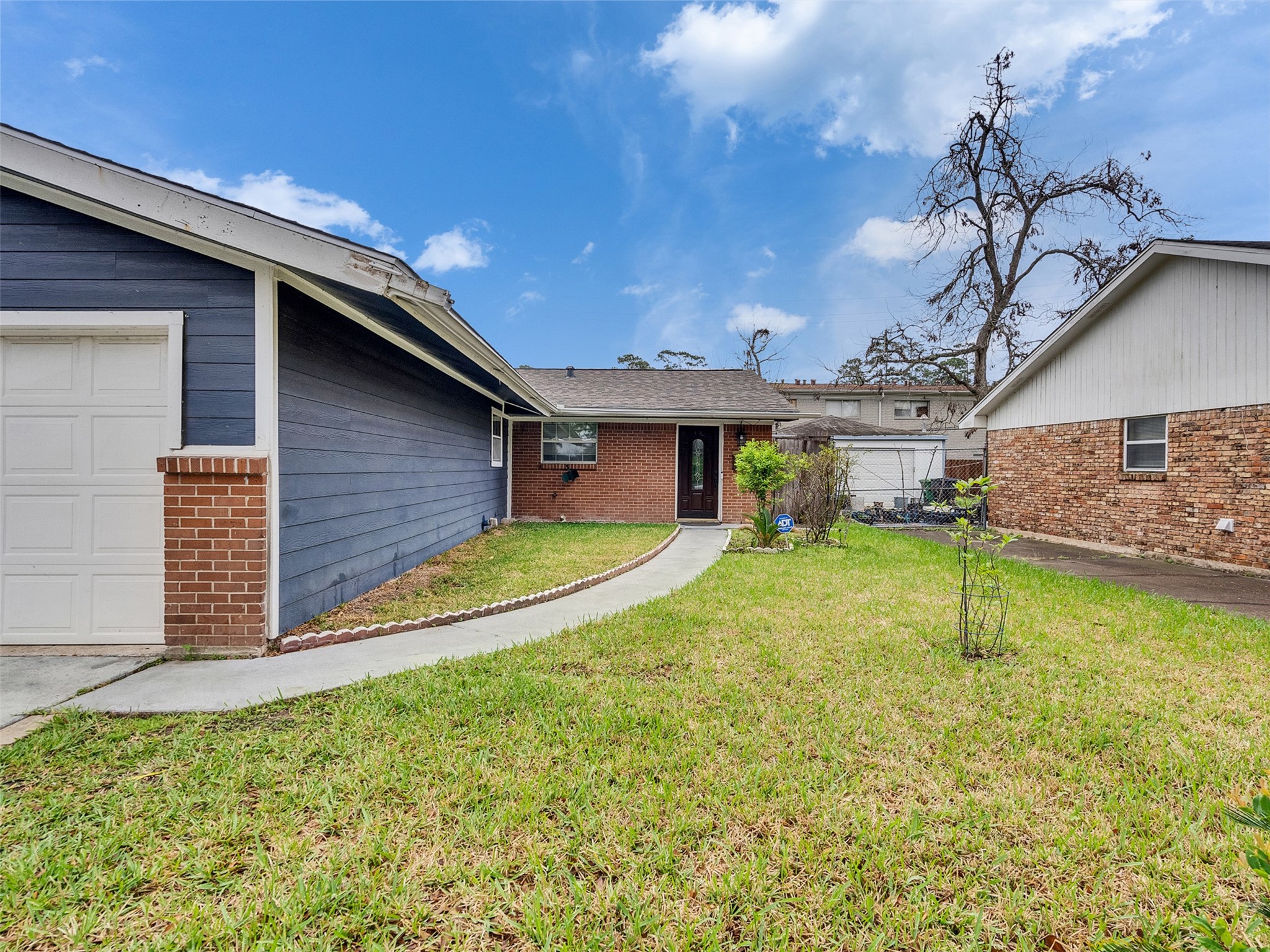 1630 Hollow Hook Road Houston, TX 77080 - Photo 3 of 22 a view of a house with a backyard and a patio