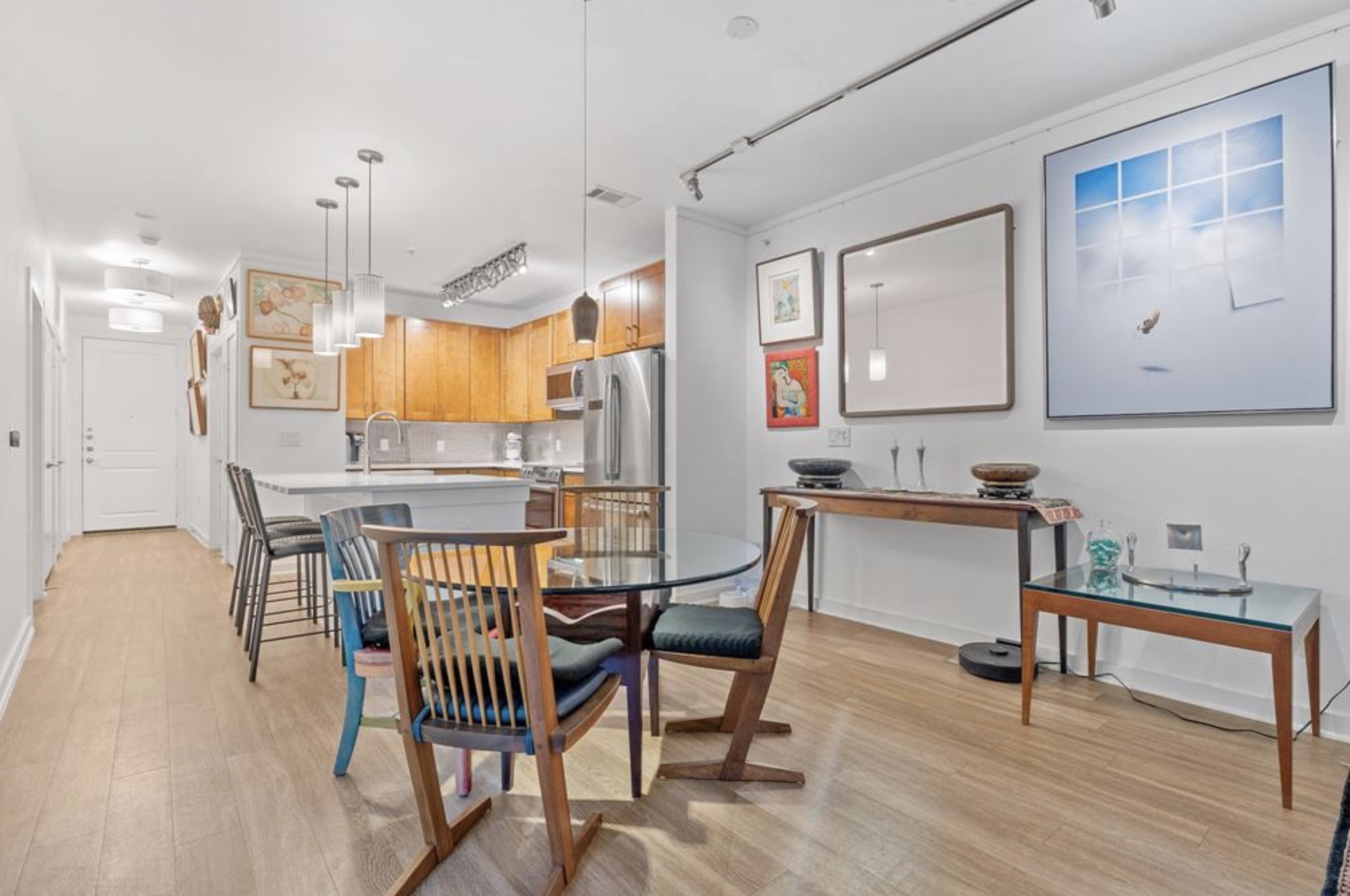 1900 Barton Springs Road, Unit 3031 Austin, TX 78704 - Photo 11 of 37 a view of kitchen with cabinets and wooden floor