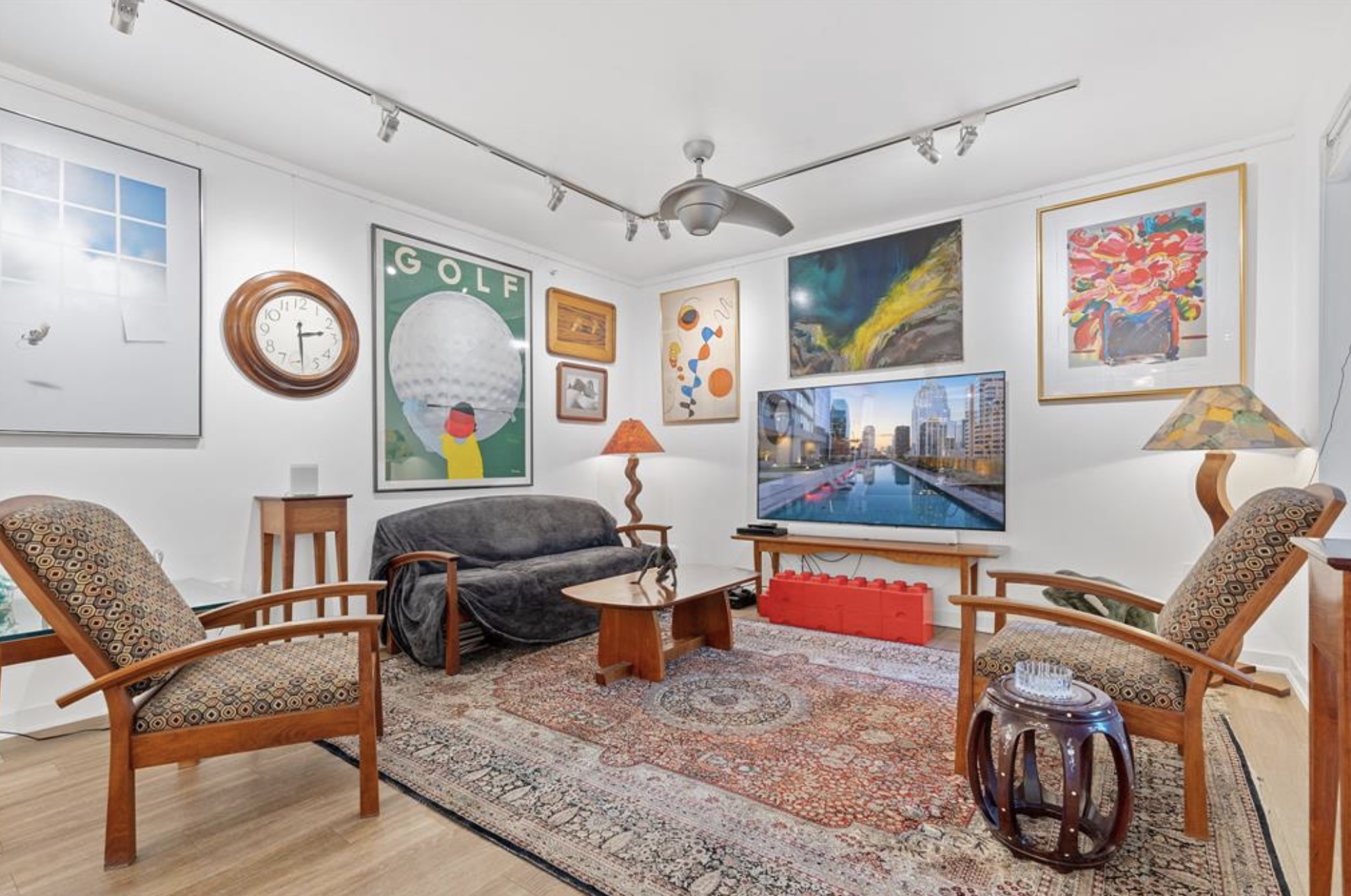 1900 Barton Springs Road, Unit 3031 Austin, TX 78704 - Photo 12 of 37 a living room with furniture and paintings on the wall
