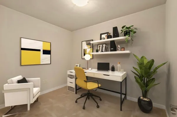 a workspace with furniture and a potted plant