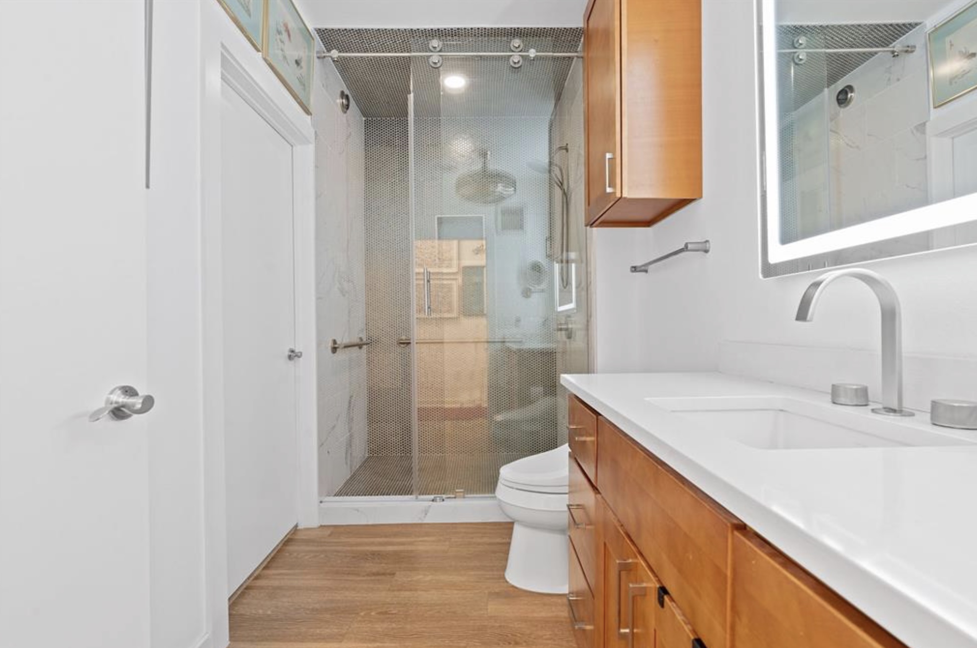1900 Barton Springs Road, Unit 3031 Austin, TX 78704 - Photo 23 of 37 a bathroom with a sink a toilet and shower