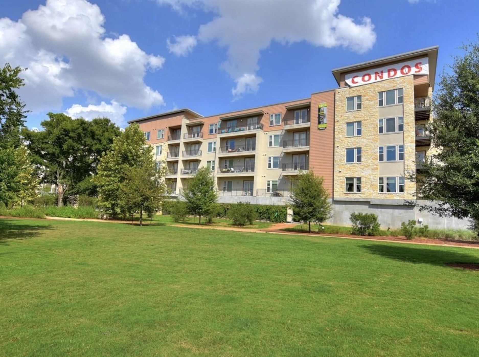 1900 Barton Springs Road, Unit 3031 Austin, TX 78704 - Photo 36 of 37 a front view of a building with a garden