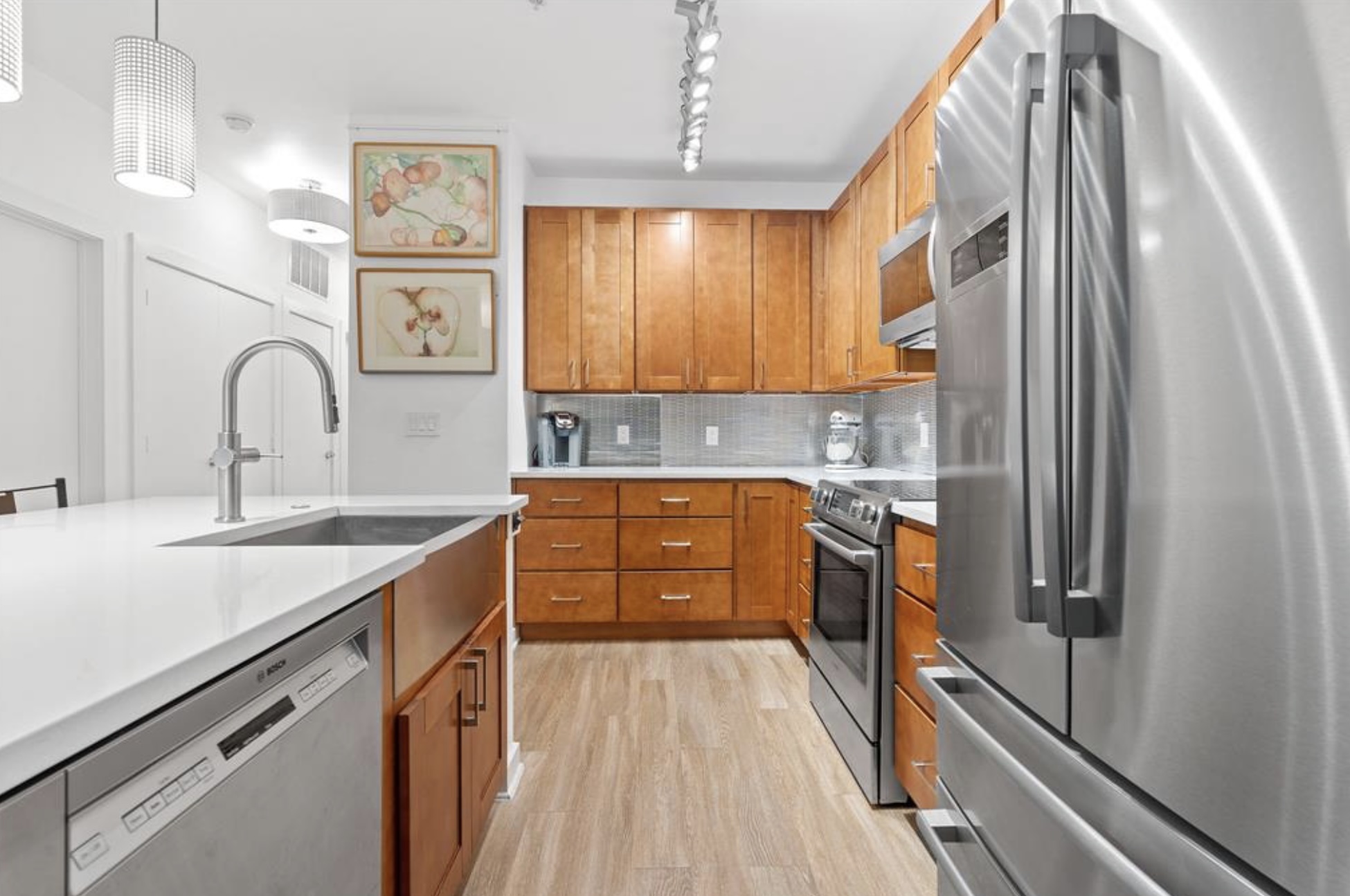 1900 Barton Springs Road, Unit 3031 Austin, TX 78704 - Photo 4 of 37 a kitchen with stainless steel appliances a sink stove and refrigerator
