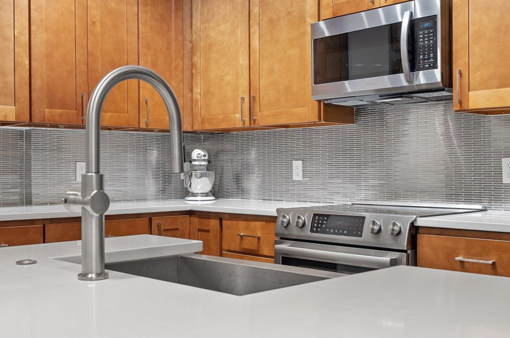 1900 Barton Springs Road, Unit 3031 Austin, TX 78704 - Photo 5 of 37 a kitchen with stainless steel appliances granite countertop a sink and a microwave