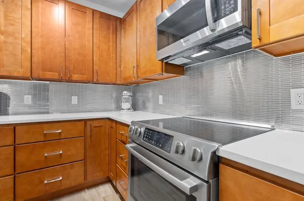 a kitchen with a sink and cabinets
