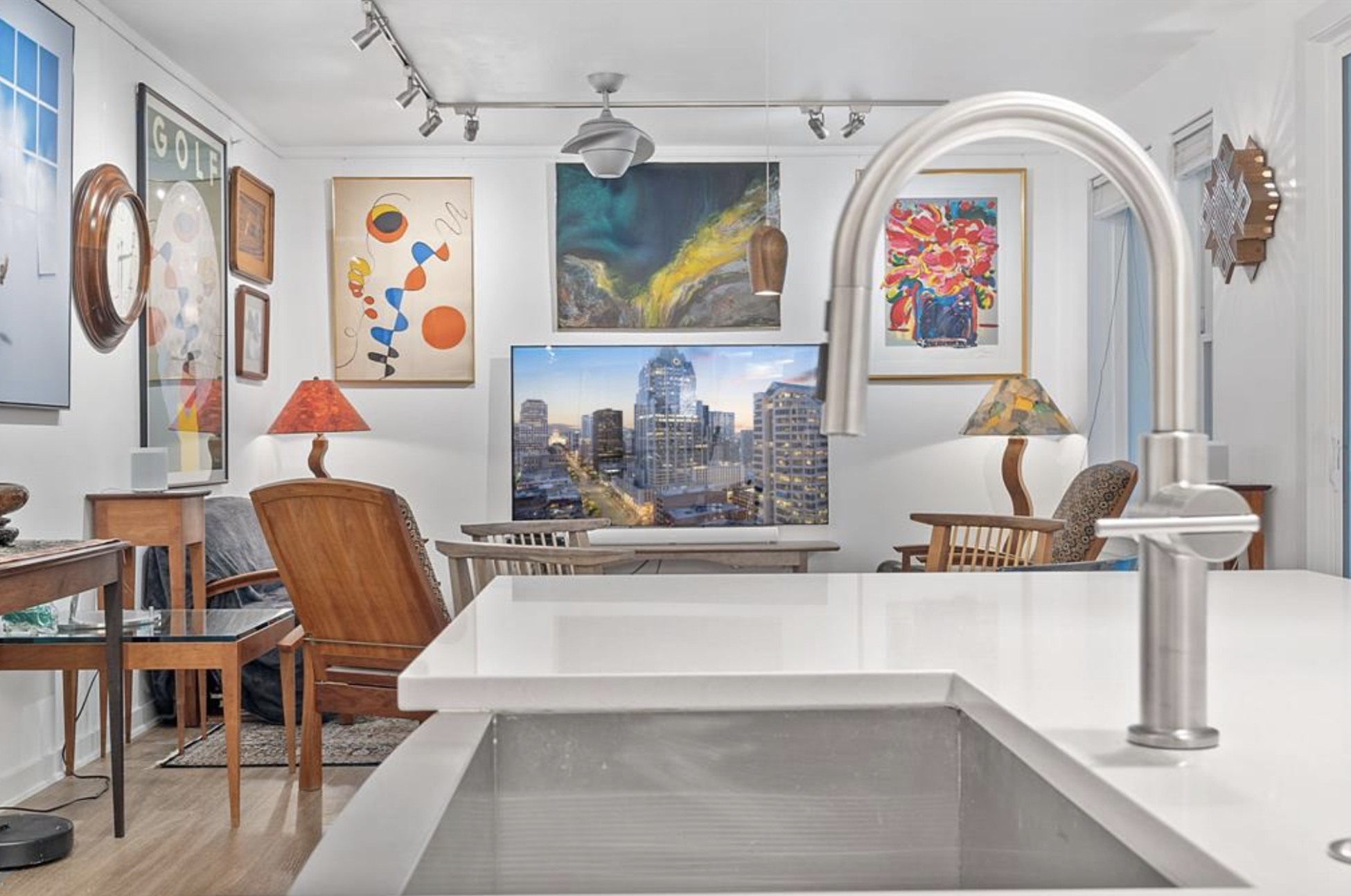 1900 Barton Springs Road, Unit 3031 Austin, TX 78704 - Photo 9 of 37 a living room with furniture and paintings on the wall