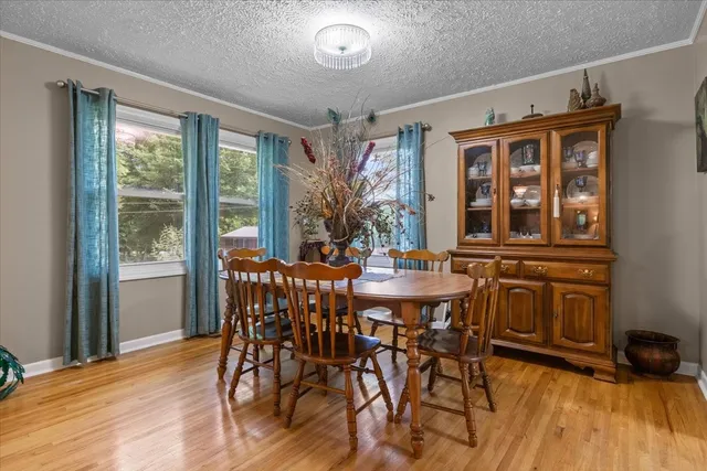 a view of a dining room with furniture window and outside view