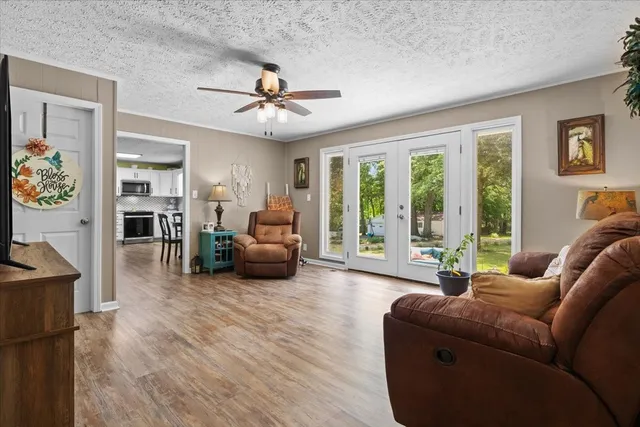 a living room with furniture and a large window