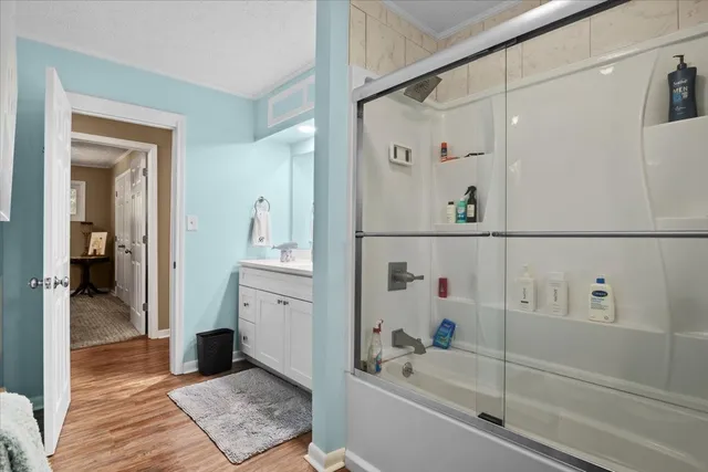 a bathroom with a bathtub and a shower