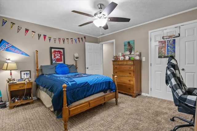 a spacious bedroom with a bed and furniture