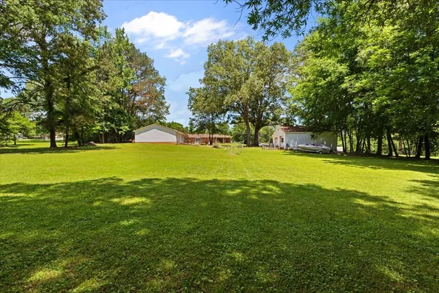 a view of a swimming pool with an outdoor space and seating area