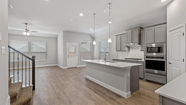 an aerial view of a house with outdoor space